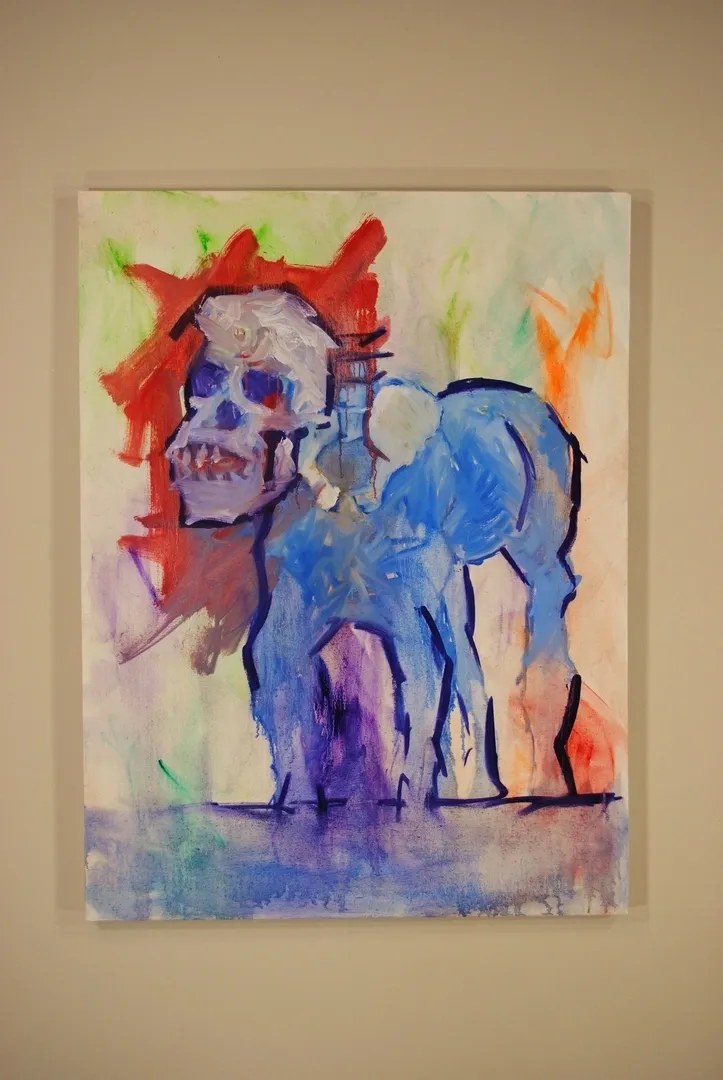 A painting of a horse with a skull on its head.